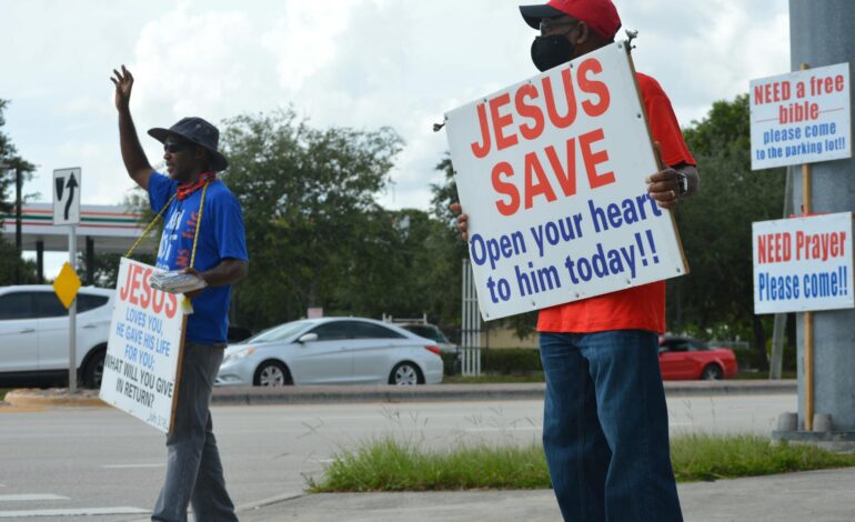 Person praying with hands clasped, symbolizing faith and action
