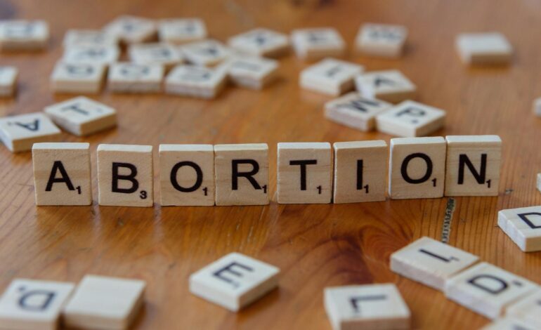 A diverse group of people engaged in a discussion about Islamic teachings and modern societal norms.