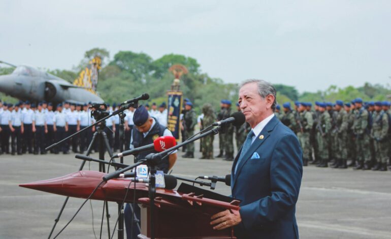 A journalist writing in a dimly lit room with a map of Islamic countries in the background, symbolizing the struggle for freedom of speech.